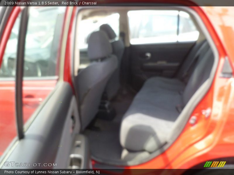 Red Brick / Charcoal 2009 Nissan Versa 1.8 S Sedan