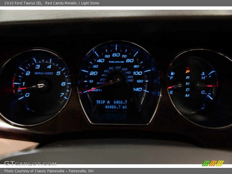 Red Candy Metallic / Light Stone 2010 Ford Taurus SEL
