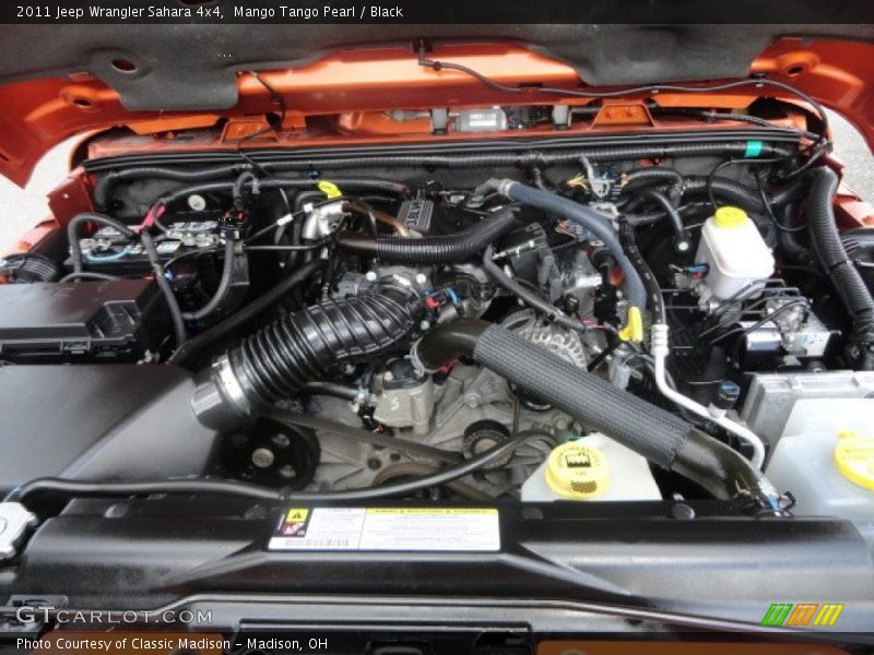 Mango Tango Pearl / Black 2011 Jeep Wrangler Sahara 4x4