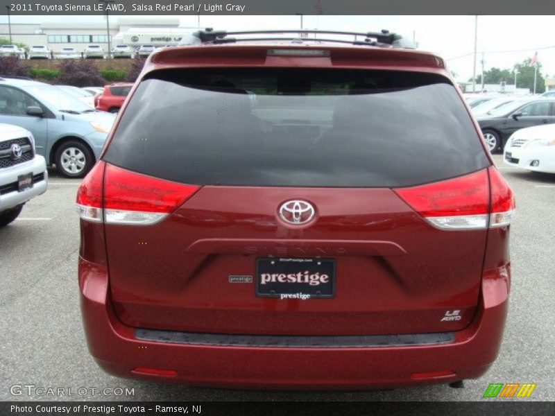 Salsa Red Pearl / Light Gray 2011 Toyota Sienna LE AWD