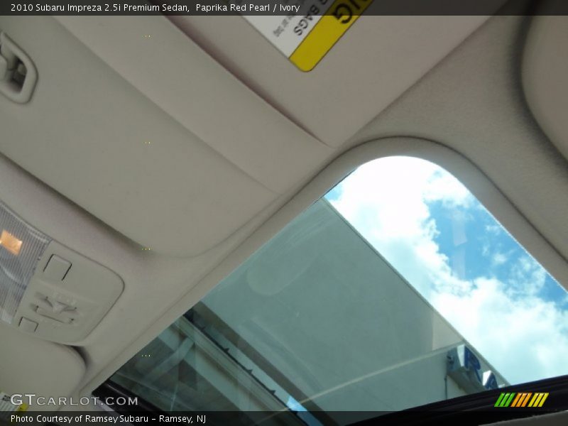 Paprika Red Pearl / Ivory 2010 Subaru Impreza 2.5i Premium Sedan