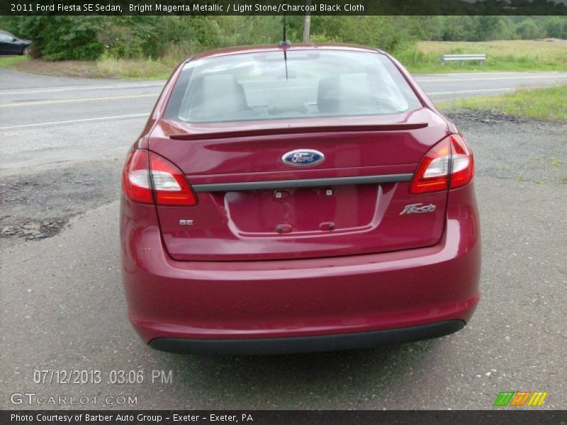 Bright Magenta Metallic / Light Stone/Charcoal Black Cloth 2011 Ford Fiesta SE Sedan