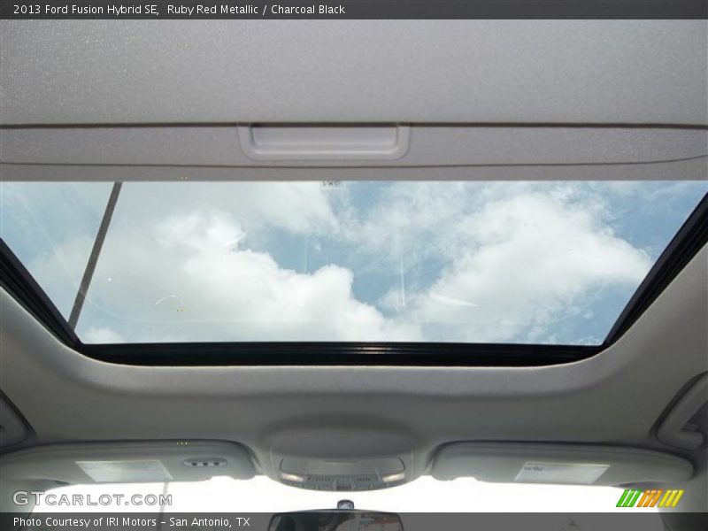 Ruby Red Metallic / Charcoal Black 2013 Ford Fusion Hybrid SE