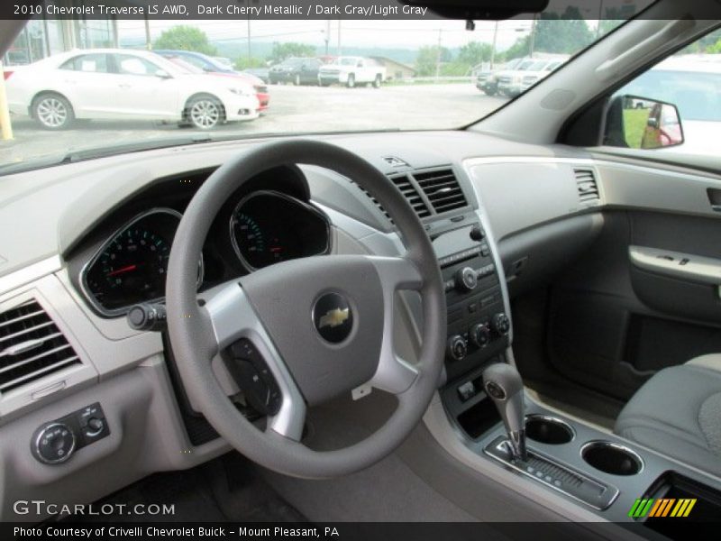 Dark Cherry Metallic / Dark Gray/Light Gray 2010 Chevrolet Traverse LS AWD