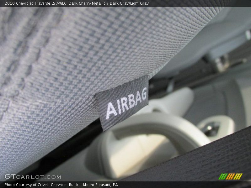 Dark Cherry Metallic / Dark Gray/Light Gray 2010 Chevrolet Traverse LS AWD