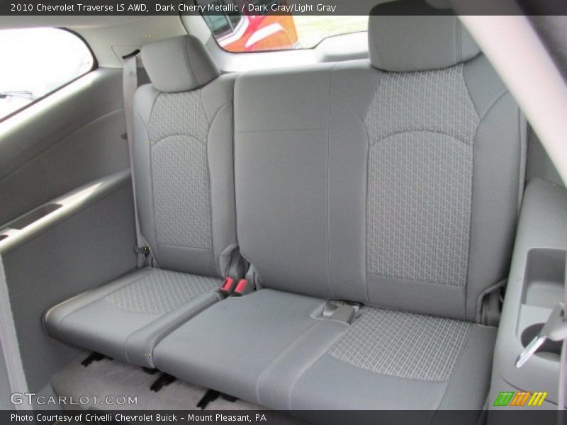 Dark Cherry Metallic / Dark Gray/Light Gray 2010 Chevrolet Traverse LS AWD