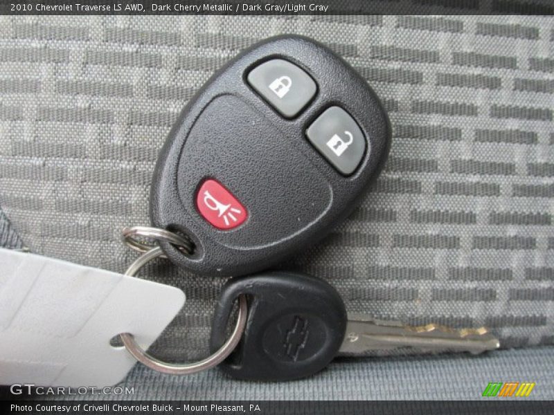 Dark Cherry Metallic / Dark Gray/Light Gray 2010 Chevrolet Traverse LS AWD