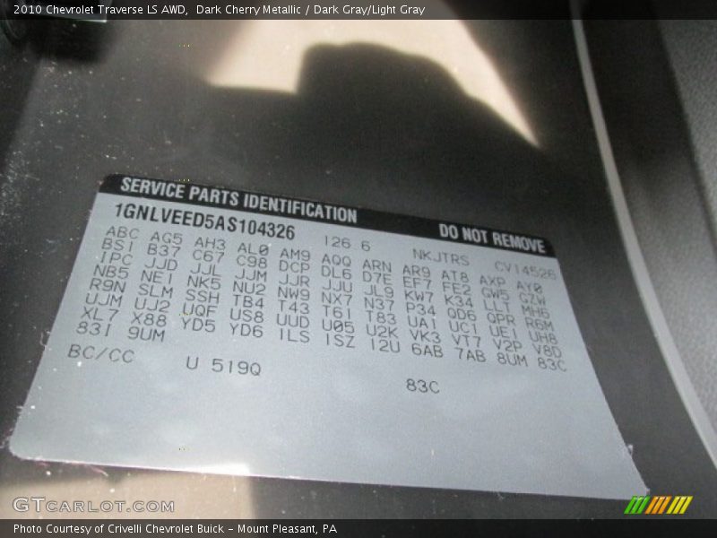 Dark Cherry Metallic / Dark Gray/Light Gray 2010 Chevrolet Traverse LS AWD