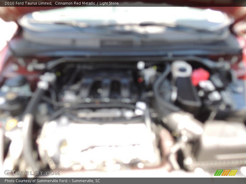 Cinnamon Red Metallic / Light Stone 2010 Ford Taurus Limited