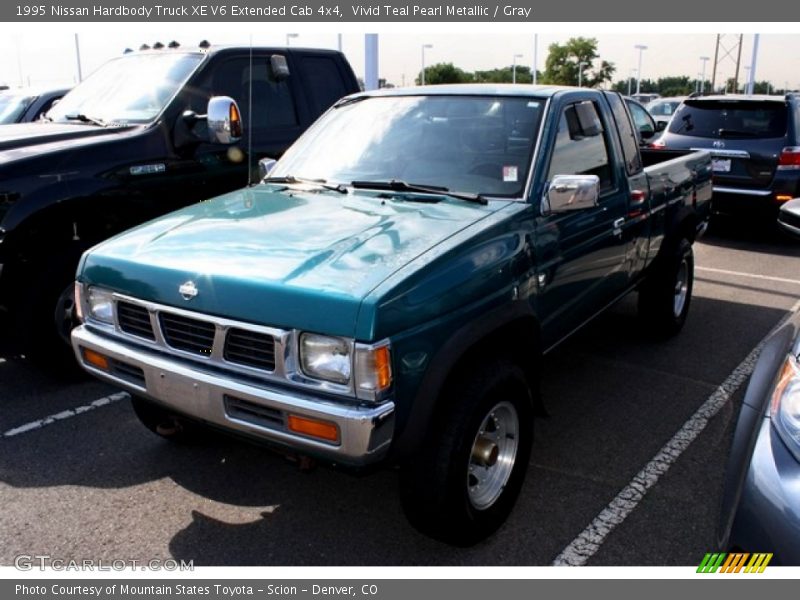Vivid Teal Pearl Metallic / Gray 1995 Nissan Hardbody Truck XE V6 Extended Cab 4x4