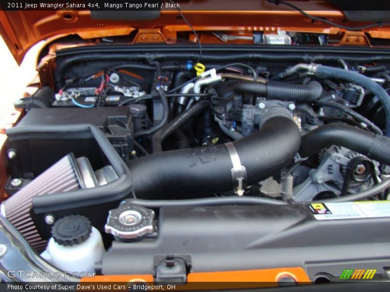 Mango Tango Pearl / Black 2011 Jeep Wrangler Sahara 4x4