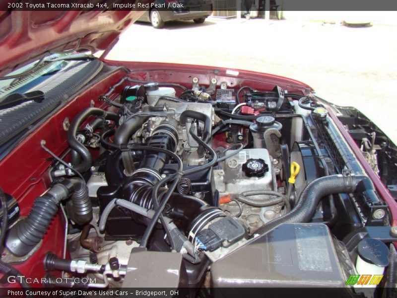 Impulse Red Pearl / Oak 2002 Toyota Tacoma Xtracab 4x4