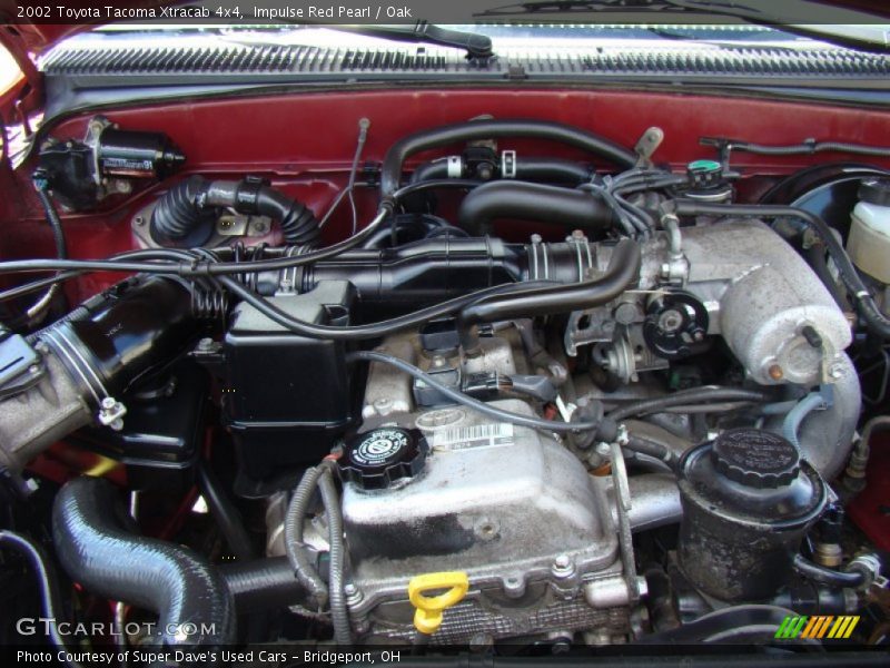 Impulse Red Pearl / Oak 2002 Toyota Tacoma Xtracab 4x4