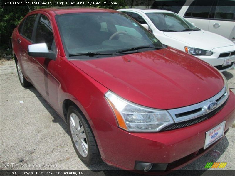 Sangria Red Metallic / Medium Stone 2010 Ford Focus SEL Sedan