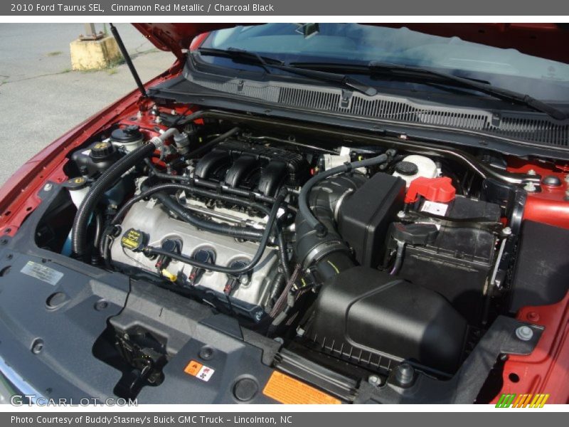 Cinnamon Red Metallic / Charcoal Black 2010 Ford Taurus SEL