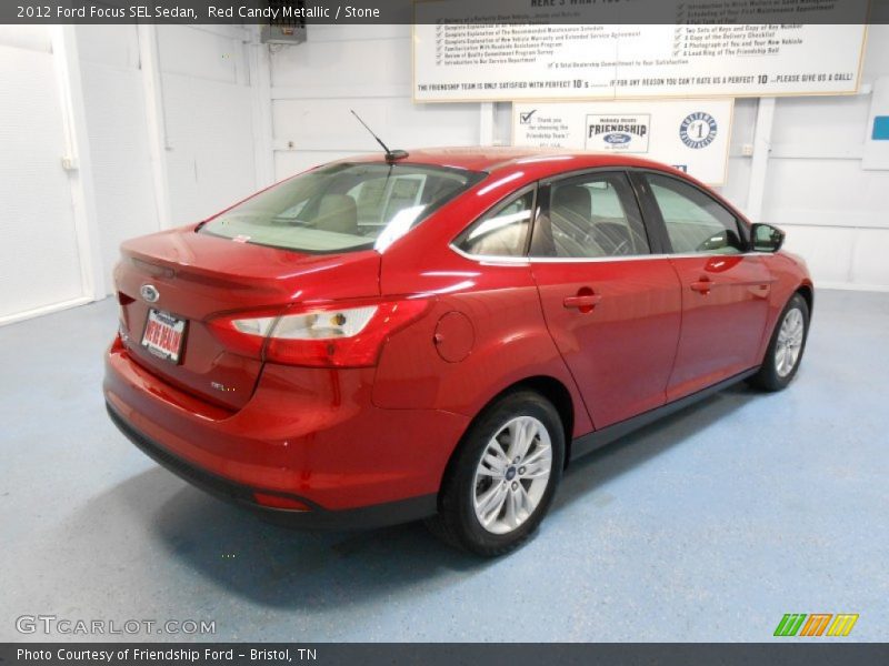 Red Candy Metallic / Stone 2012 Ford Focus SEL Sedan