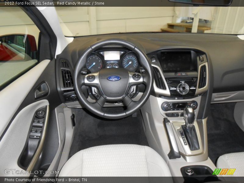 Red Candy Metallic / Stone 2012 Ford Focus SEL Sedan