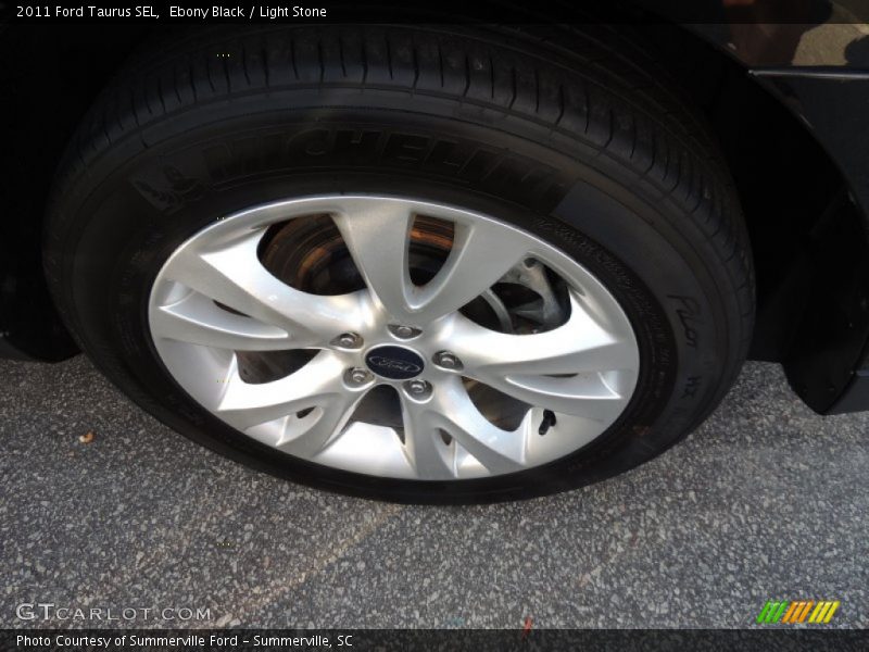 Ebony Black / Light Stone 2011 Ford Taurus SEL