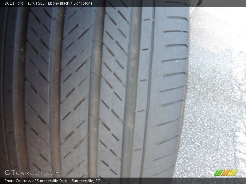 Ebony Black / Light Stone 2011 Ford Taurus SEL