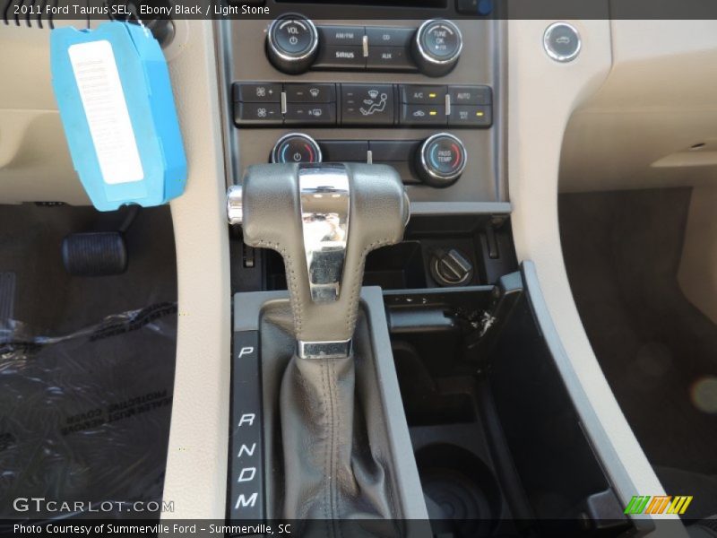 Ebony Black / Light Stone 2011 Ford Taurus SEL