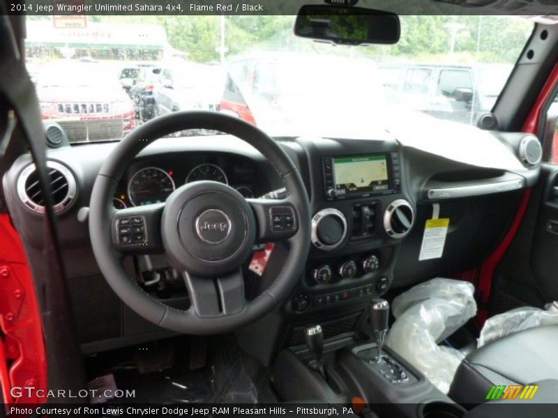 Dashboard of 2014 Wrangler Unlimited Sahara 4x4