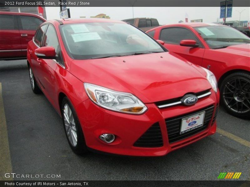 Race Red / Stone 2012 Ford Focus SEL Sedan