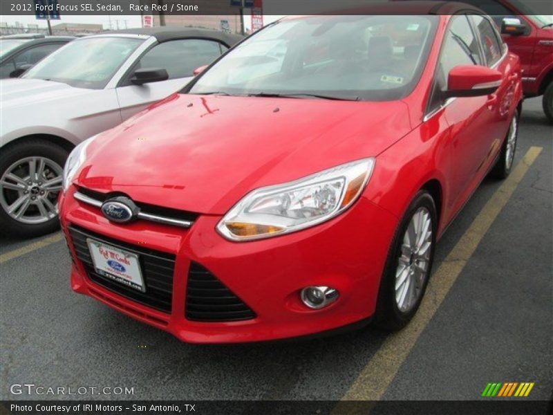Race Red / Stone 2012 Ford Focus SEL Sedan