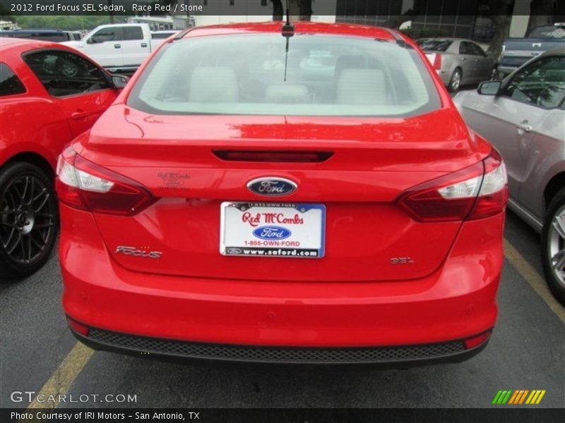 Race Red / Stone 2012 Ford Focus SEL Sedan