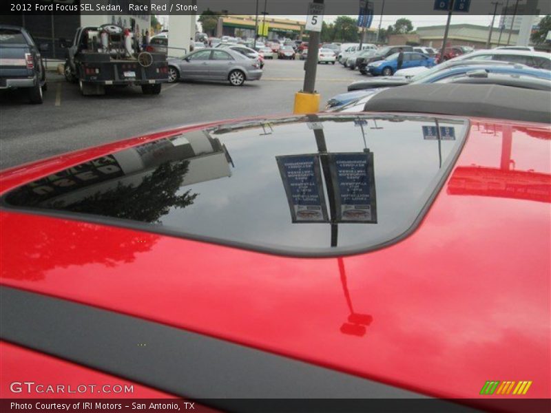 Race Red / Stone 2012 Ford Focus SEL Sedan