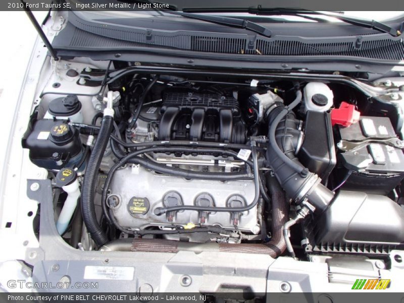 Ingot Silver Metallic / Light Stone 2010 Ford Taurus SE