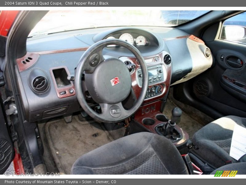 Dashboard of 2004 ION 3 Quad Coupe