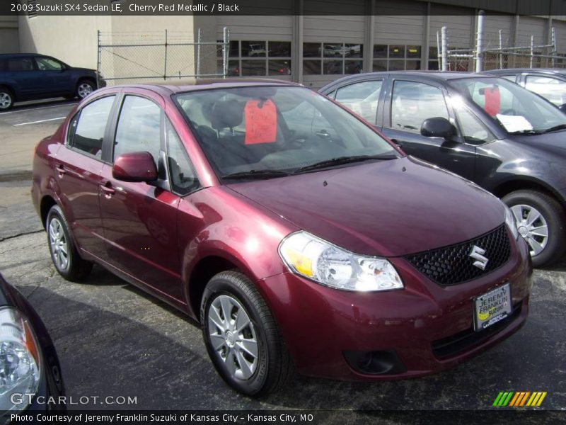 Cherry Red Metallic / Black 2009 Suzuki SX4 Sedan LE
