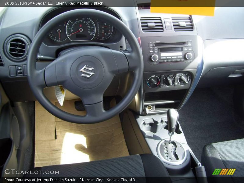 Cherry Red Metallic / Black 2009 Suzuki SX4 Sedan LE