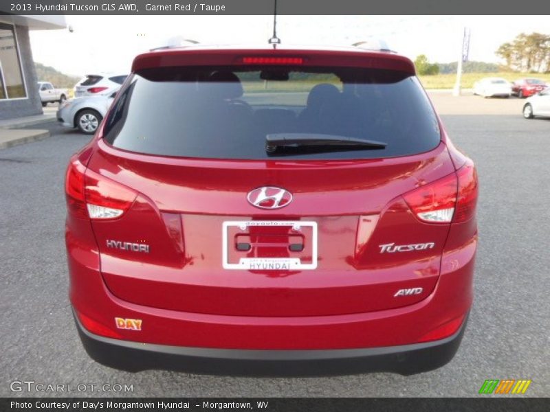Garnet Red / Taupe 2013 Hyundai Tucson GLS AWD