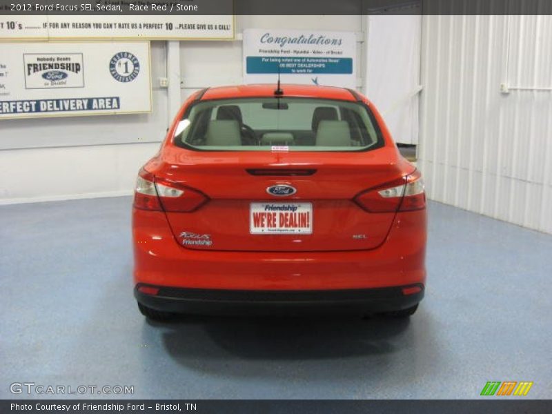 Race Red / Stone 2012 Ford Focus SEL Sedan
