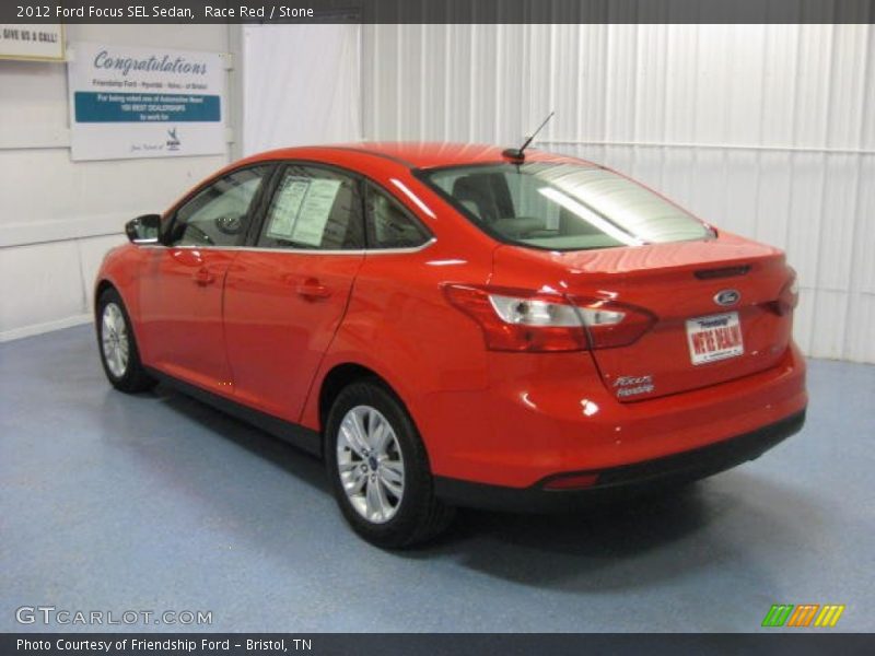 Race Red / Stone 2012 Ford Focus SEL Sedan