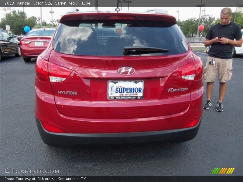 Garnet Red / Taupe 2013 Hyundai Tucson GLS