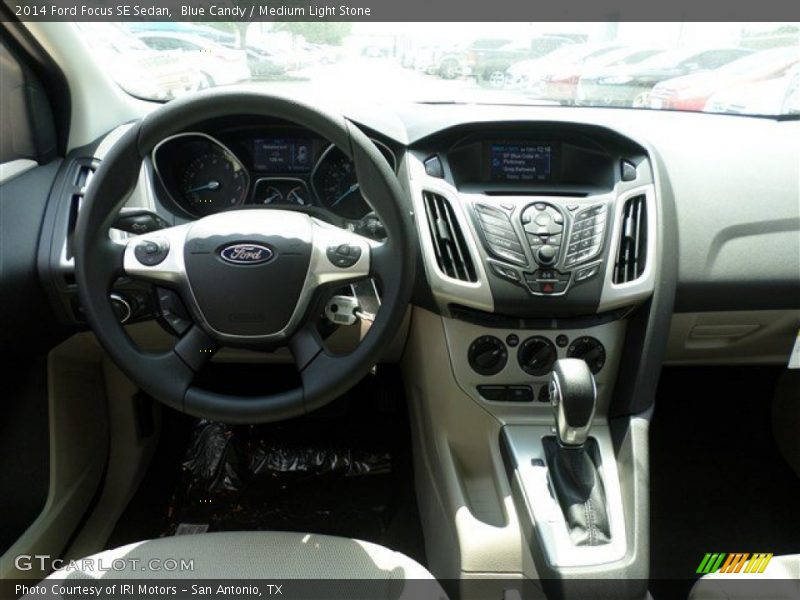 Blue Candy / Medium Light Stone 2014 Ford Focus SE Sedan