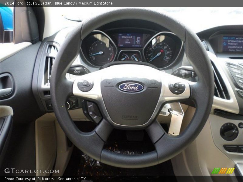 Blue Candy / Medium Light Stone 2014 Ford Focus SE Sedan