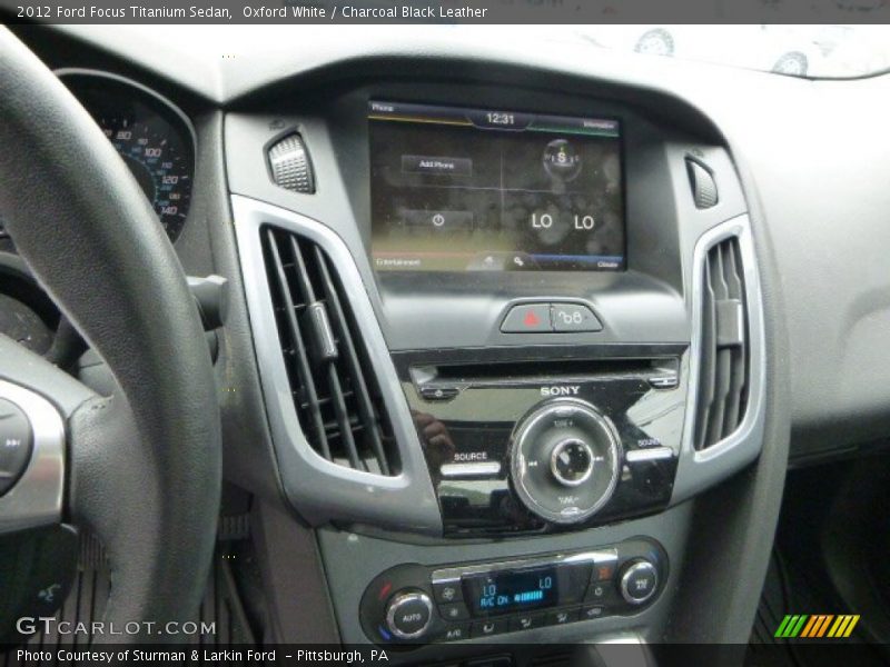 Oxford White / Charcoal Black Leather 2012 Ford Focus Titanium Sedan