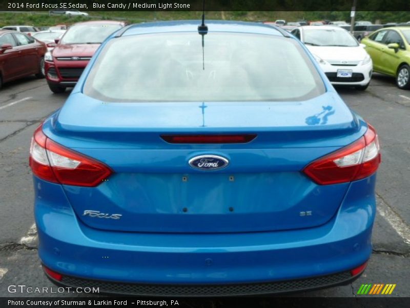 Blue Candy / Medium Light Stone 2014 Ford Focus SE Sedan