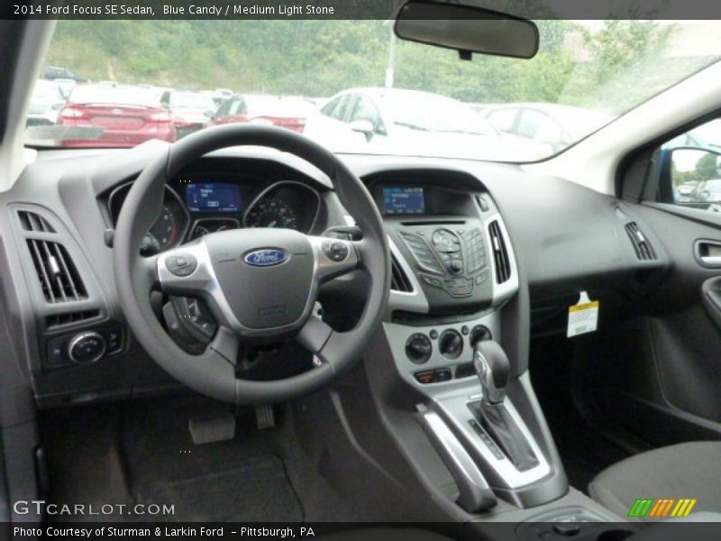 Blue Candy / Medium Light Stone 2014 Ford Focus SE Sedan