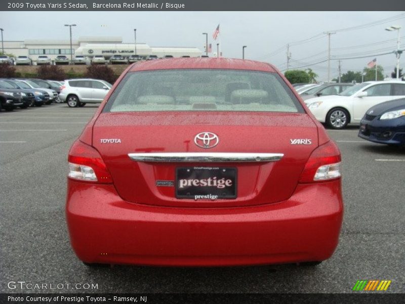 Barcelona Red Metallic / Bisque 2009 Toyota Yaris S Sedan