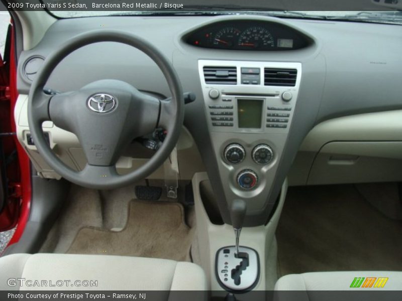 Barcelona Red Metallic / Bisque 2009 Toyota Yaris S Sedan