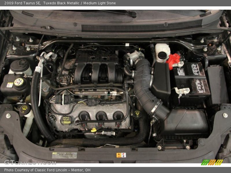 Tuxedo Black Metallic / Medium Light Stone 2009 Ford Taurus SE