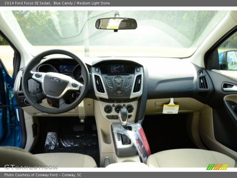 Blue Candy / Medium Light Stone 2014 Ford Focus SE Sedan