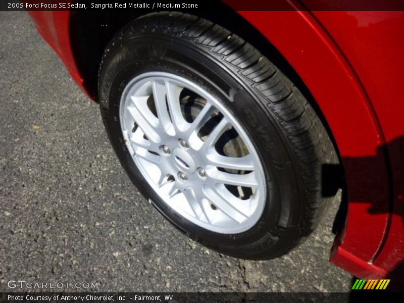 Sangria Red Metallic / Medium Stone 2009 Ford Focus SE Sedan