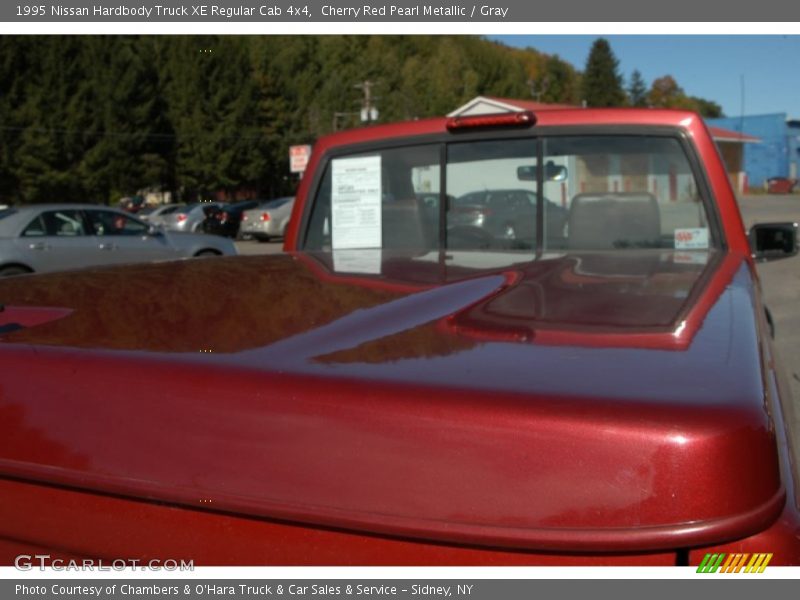 Cherry Red Pearl Metallic / Gray 1995 Nissan Hardbody Truck XE Regular Cab 4x4