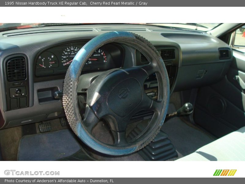 Cherry Red Pearl Metallic / Gray 1995 Nissan Hardbody Truck XE Regular Cab