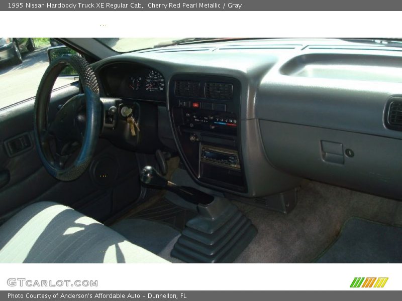 Cherry Red Pearl Metallic / Gray 1995 Nissan Hardbody Truck XE Regular Cab